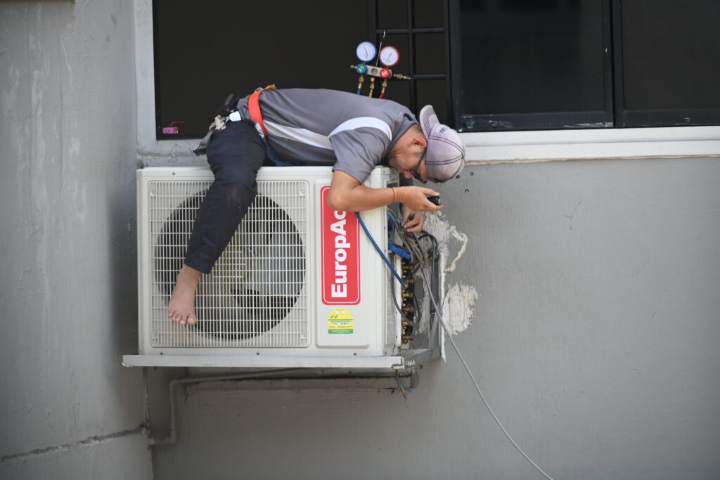 HVAC contractor using CRM software on a tablet