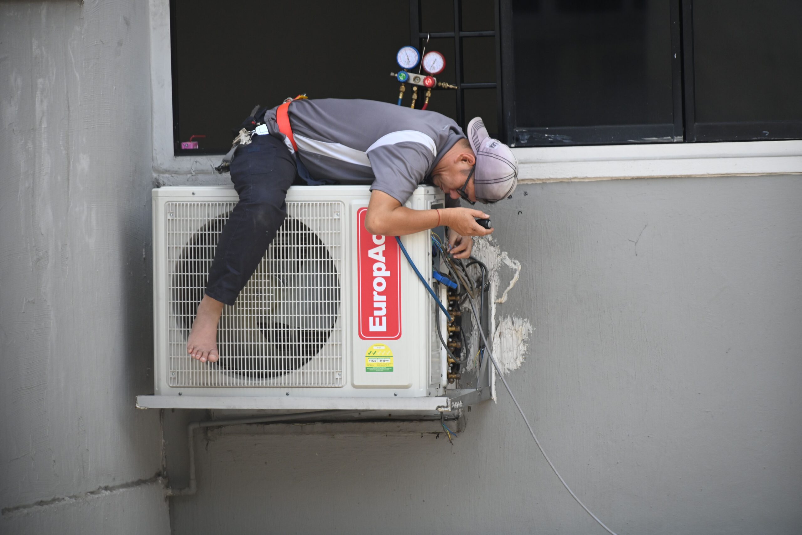 HVAC contractor using CRM software on a tablet
