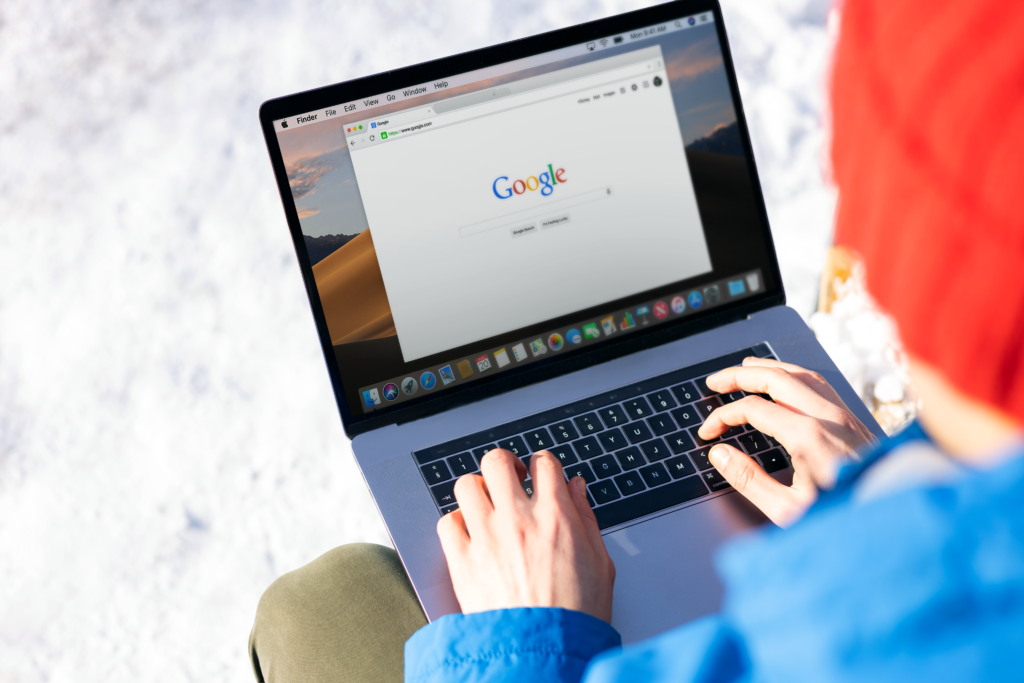 A person analyzing SEO keywords on a laptop